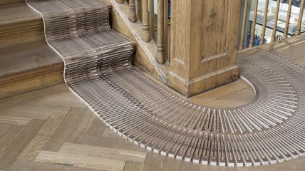 wooden carpet runner going round curve designed by Annette Douglas for Gewerbemuseum Winterthur