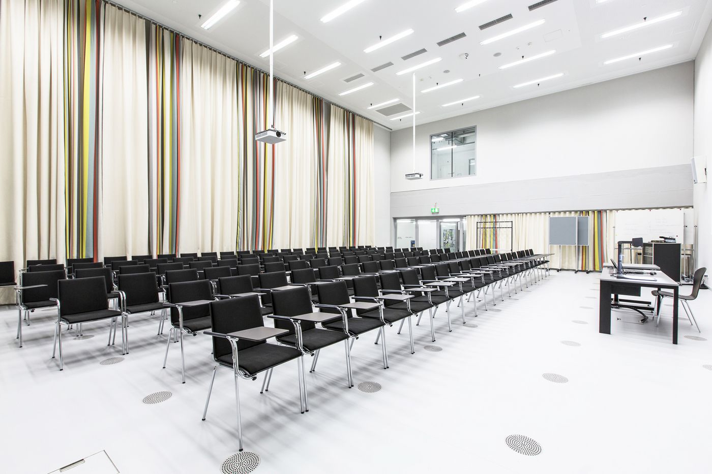 big lecture hall acoustic curtain mono-toni and multi-toni designed by Annette Douglas